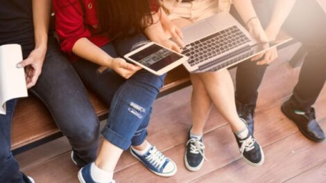 College kids meeting with laptops and tablets