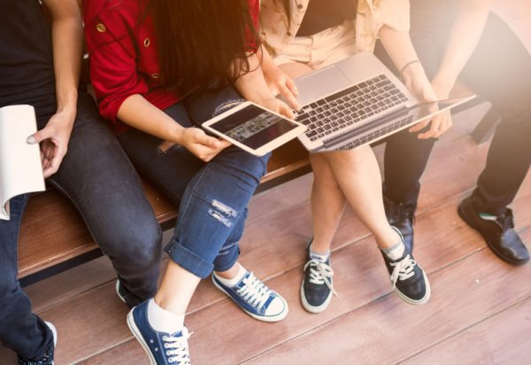 College kids meeting with laptops and tablets