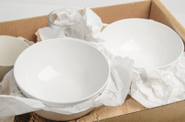 Dishes wrapped up in a box