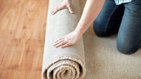 Rolling up a rug for storage