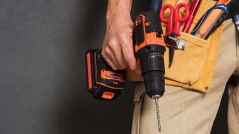 A man holding hand and power tools