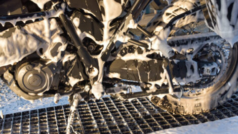 A motorcycle suds while being cleaned