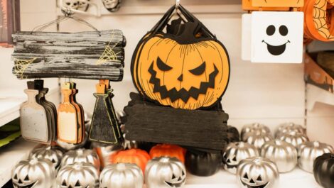 Halloween decor sitting on a table ready to be packed away for next year.