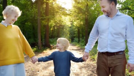 A senior man hugging his daughter