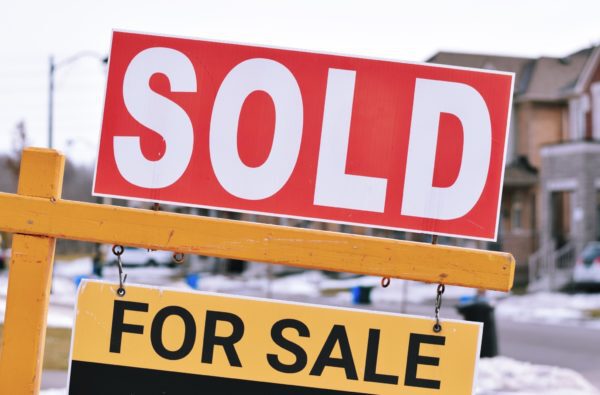 Sold sign on a winter day