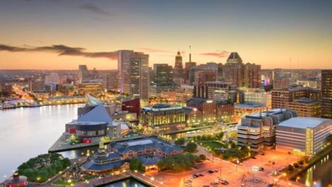 Skyline view of the inner harbor in Baltimore, Maryland at dusk.