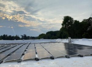 Solar panels on the roof of a storage unit facility building.